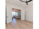 Bedroom with hardwood floors and doors opening to the living room at 4723 E Desert Park Pl, Paradise Valley, AZ 85253