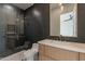 Bathroom with dark tile and a walk-in shower at 4723 E Desert Park Pl, Paradise Valley, AZ 85253