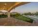 Spacious covered patio with putting green and mountain views at 4723 E Desert Park Pl, Paradise Valley, AZ 85253