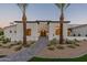 Stunning white exterior with a charming walkway leading to the arched entryway at 4723 E Desert Park Pl, Paradise Valley, AZ 85253