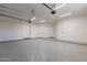 Clean and well-lit three car garage with additional storage at 4723 E Desert Park Pl, Paradise Valley, AZ 85253