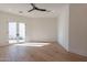 Bright bedroom with hardwood floors and french doors leading to a patio at 4723 E Desert Park Pl, Paradise Valley, AZ 85253