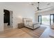 Spacious bedroom with hardwood floors and private access to backyard at 4723 E Desert Park Pl, Paradise Valley, AZ 85253