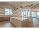Modern kitchen featuring a large island, custom cabinetry, and a breakfast bar at 4723 E Desert Park Pl, Paradise Valley, AZ 85253