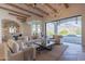 Open concept living room with large windows and access to backyard at 4723 E Desert Park Pl, Paradise Valley, AZ 85253