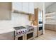 High-end kitchen with professional range and ample cabinetry at 4723 E Desert Park Pl, Paradise Valley, AZ 85253
