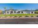 Stunning modern home with white exterior and manicured lawn at 4723 E Desert Park Pl, Paradise Valley, AZ 85253
