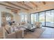 Open concept living room with large windows and access to backyard at 4723 E Desert Park Pl, Paradise Valley, AZ 85253