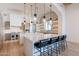 Open kitchen with island seating and high-end finishes at 4723 E Desert Park Pl, Paradise Valley, AZ 85253