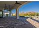 Covered patio overlooking a refreshing pool and scenic mountain backdrop at 4723 E Desert Park Pl, Paradise Valley, AZ 85253