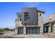 Modern home exterior with stone and metal accents at 37200 N Cave Creek Rd # 2110, Scottsdale, AZ 85262