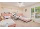 Bedroom with two twin beds, plenty of stuffed animals, and natural light at 9020 N 33Rd Way, Phoenix, AZ 85028