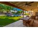 Covered patio with outdoor dining and pool view at 9020 N 33Rd Way, Phoenix, AZ 85028
