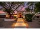 Stunning home exterior with beautifully landscaped entryway at 9020 N 33Rd Way, Phoenix, AZ 85028