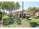 House exterior with landscaped yard and palm tree at 9118 W Topeka Dr, Peoria, AZ 85382