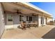 Covered patio with ceiling fans, outdoor seating, and built-in grill at 11801 S 193Rd Dr, Buckeye, AZ 85326