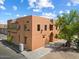 Spanish-style building with multiple windows and a landscaped area at 16844 E Ave Of The Fountains -- # 102, Fountain Hills, AZ 85268