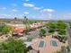 Aerial view of a community with shops, fountains, and a lake at 16844 E Ave Of The Fountains -- # 102, Fountain Hills, AZ 85268