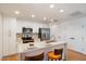 Modern kitchen with white cabinets and a large island at 16844 E Ave Of The Fountains -- # 102, Fountain Hills, AZ 85268