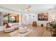 Living room with hardwood floors, comfy seating and art at 16844 E Ave Of The Fountains -- # 102, Fountain Hills, AZ 85268
