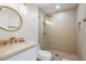 Elegant bathroom with a frameless shower, modern vanity, and gold fixtures at 16844 E Ave Of The Fountains -- # 102, Fountain Hills, AZ 85268