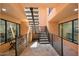 Modern stairwell with metal railings and tile flooring at 16844 E Ave Of The Fountains -- # 102, Fountain Hills, AZ 85268