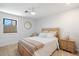 Bright bedroom with light wood furniture and large window at 16844 E Ave Of The Fountains -- # 102, Fountain Hills, AZ 85268