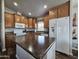 Modern kitchen with wood cabinets and large island at 650 N Hawes Rd # 3809, Mesa, AZ 85207