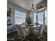 Charming dining area with glass table and four gold chairs at 650 N Hawes Rd # 3809, Mesa, AZ 85207