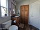 Bathroom with wood cabinets and a toilet at 650 N Hawes Rd # 3809, Mesa, AZ 85207
