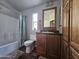 Clean bathroom with wood cabinets and a shower/tub combo at 650 N Hawes Rd # 3809, Mesa, AZ 85207