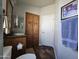 Bathroom with wood cabinets and a door to another room at 650 N Hawes Rd # 3809, Mesa, AZ 85207