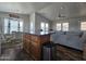 Open kitchen with island, wood cabinets, and breakfast bar at 650 N Hawes Rd # 3809, Mesa, AZ 85207