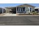 Mobile home with covered patio and landscaping at 650 N Hawes Rd # 3809, Mesa, AZ 85207