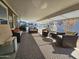 Relaxing covered patio with seating and a fan at 650 N Hawes Rd # 3809, Mesa, AZ 85207