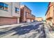 View of townhome community from the alley showcasing parking at 1632 N 77Th Gln, Phoenix, AZ 85035