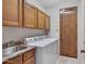 Laundry room with washer, dryer, and ample cabinetry at 8874 E Flathorn Dr, Scottsdale, AZ 85255