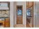 Walk-through kitchen pantry with custom wood door at 8874 E Flathorn Dr, Scottsdale, AZ 85255