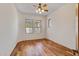 Bright bedroom featuring hardwood floors and ceiling fan at 8874 E Flathorn Dr, Scottsdale, AZ 85255