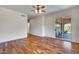 Bedroom with hardwood floors, sliding door to patio, and ceiling fan at 8874 E Flathorn Dr, Scottsdale, AZ 85255
