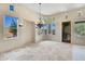Formal dining room with chandelier and tiled floor at 8874 E Flathorn Dr, Scottsdale, AZ 85255