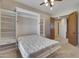 Guest bedroom with a Murphy bed and built-in storage at 8874 E Flathorn Dr, Scottsdale, AZ 85255