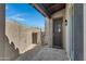 Private patio with wrought iron gate and gravel landscaping at 8874 E Flathorn Dr, Scottsdale, AZ 85255