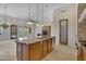 Spacious kitchen with granite countertops, island, and stainless steel appliances at 8874 E Flathorn Dr, Scottsdale, AZ 85255