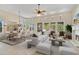 Bright and airy living room with dining area, fireplace and access to backyard at 8874 E Flathorn Dr, Scottsdale, AZ 85255