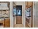 Walk-through kitchen pantry with custom wood door at 8874 E Flathorn Dr, Scottsdale, AZ 85255