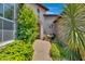 Charming courtyard entry with a fountain, lush greenery, and brick pavers at 8874 E Flathorn Dr, Scottsdale, AZ 85255