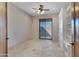 Bedroom with tile floors, sliding door to patio, and built-in shelves at 8874 E Flathorn Dr, Scottsdale, AZ 85255