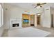 Living room features a fireplace and built-in shelving at 8874 E Flathorn Dr, Scottsdale, AZ 85255