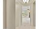 Elegant hallway with tiled floors and built-in wooden shelving at 8874 E Flathorn Dr, Scottsdale, AZ 85255